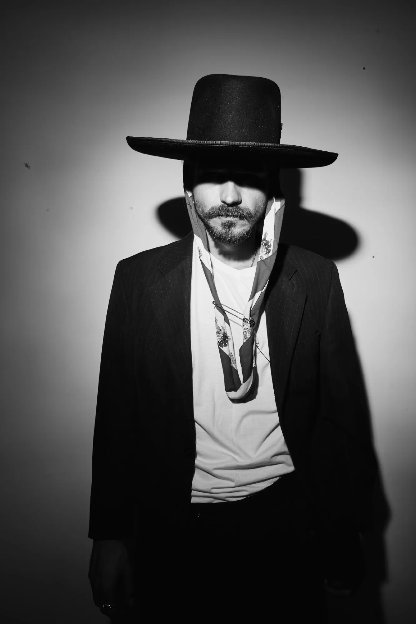 Portrait in a wide-brim black hat, black and white